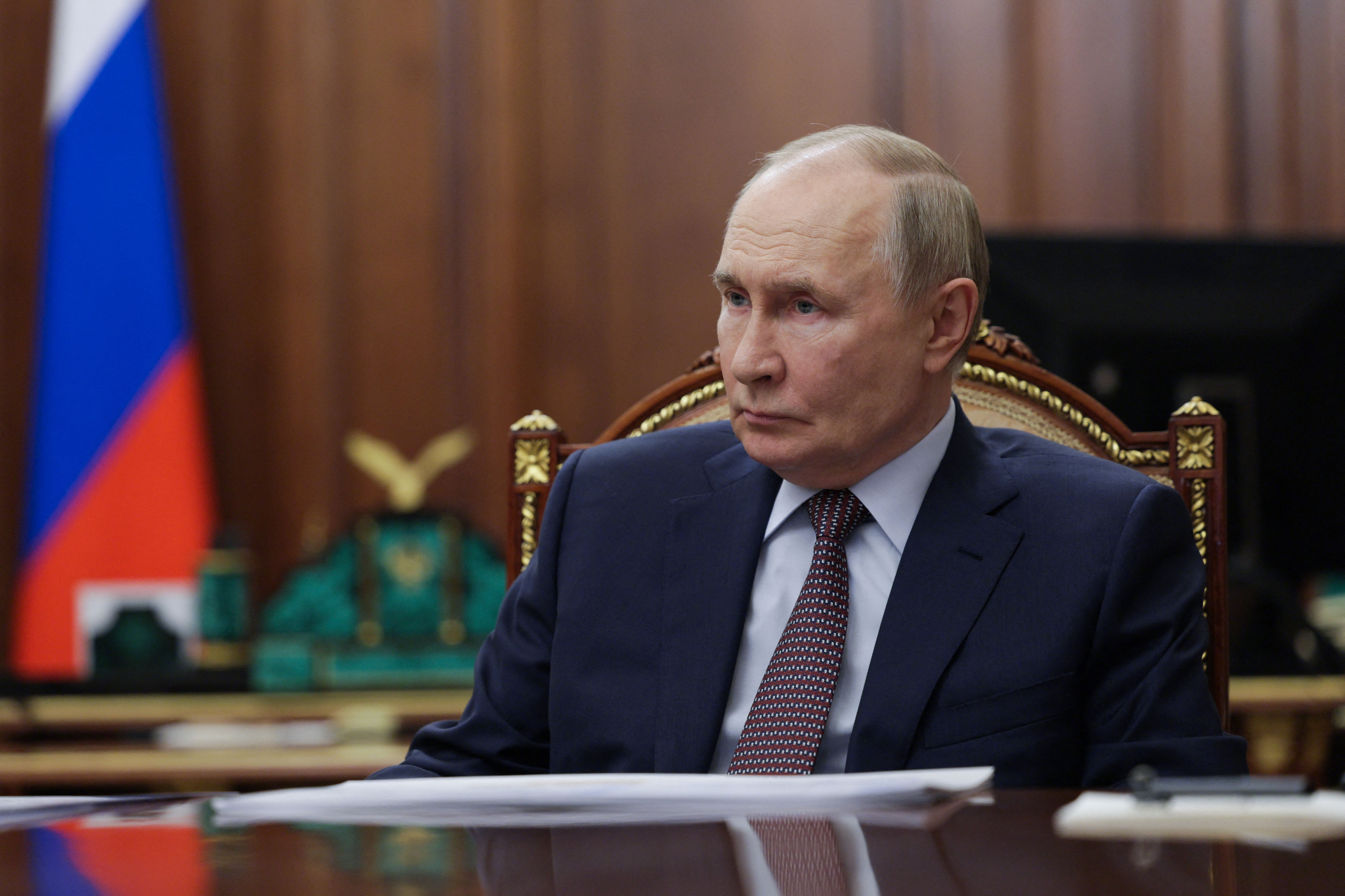 two hands shaking in a shadowy corridor